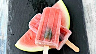 Summer sweet watermelon and mint are blended with rum in these scrumptious poptails! Watermelon Mojito Popsicles are just the thing to cool you off this summer! Replace the rum with simple syrup for a virgin version.