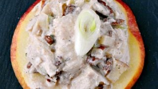 Savory and sweet chicken salad sits on top of apple slices for a delicious and quick appetizer. Chicken Salad Apple Bites are a perfect afternoon snack, easy appetizer, or quick nibble before dinner. #HealthyEatsWithChicken #EasyMealIdeas #AppleRecipes #SaladBites #InstaFoodieFaves