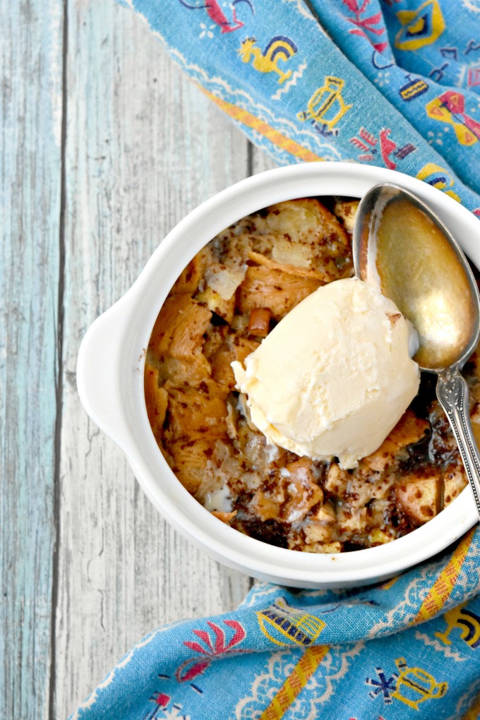 Apples and croissants swim in a delicious cinnamon custard.  Individual Apple Croissant Bread Pudding is a quick and easy dessert that will pack a stunning punch at your dinner table. #AppleWeek