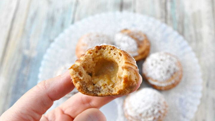 Say goodbye to boring breakfasts and hello to these Pumpkin Cheesecake Ebelskivers! Perfectly fluffy, filled with creamy pumpkin cheesecake, and finished with a dusting of powdered sugar. Your mornings just got a whole lot better. #PumpkinCheesecakeEbelskiver #FallTreats #PumpkinSpice #CulinaryDelights #FoodieFaves #PumpkinCheesecake #Ebelskivers #FallTreats #FestiveFlavors #HolidayBaking