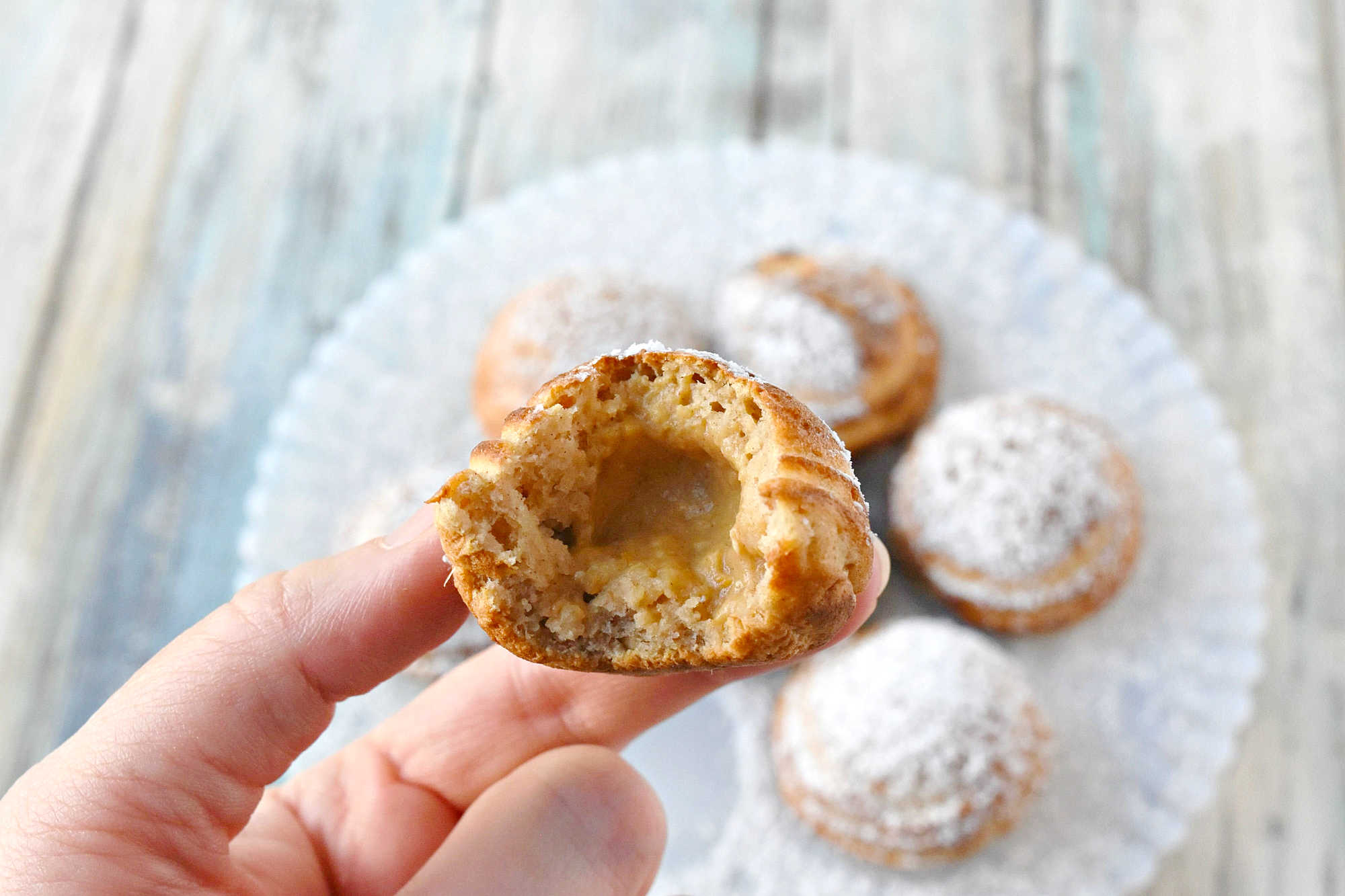 Say goodbye to boring breakfasts and hello to these Pumpkin Cheesecake Ebelskivers! Perfectly fluffy, filled with creamy pumpkin cheesecake, and finished with a dusting of powdered sugar. Your mornings just got a whole lot better.  #PumpkinCheesecakeEbelskiver #FallTreats #PumpkinSpice #CulinaryDelights #FoodieFaves #PumpkinCheesecake #Ebelskivers #FallTreats #FestiveFlavors #HolidayBaking