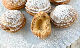 Ebelskiver are filled pancakes cooked in a pan make specifically for them.  Pumpkin Cheesecake Ebelskiver are filled with creamy, pumpkin cheesecake filling surrounded by a simple, sweet batter for a little bite of pumpkin goodness.