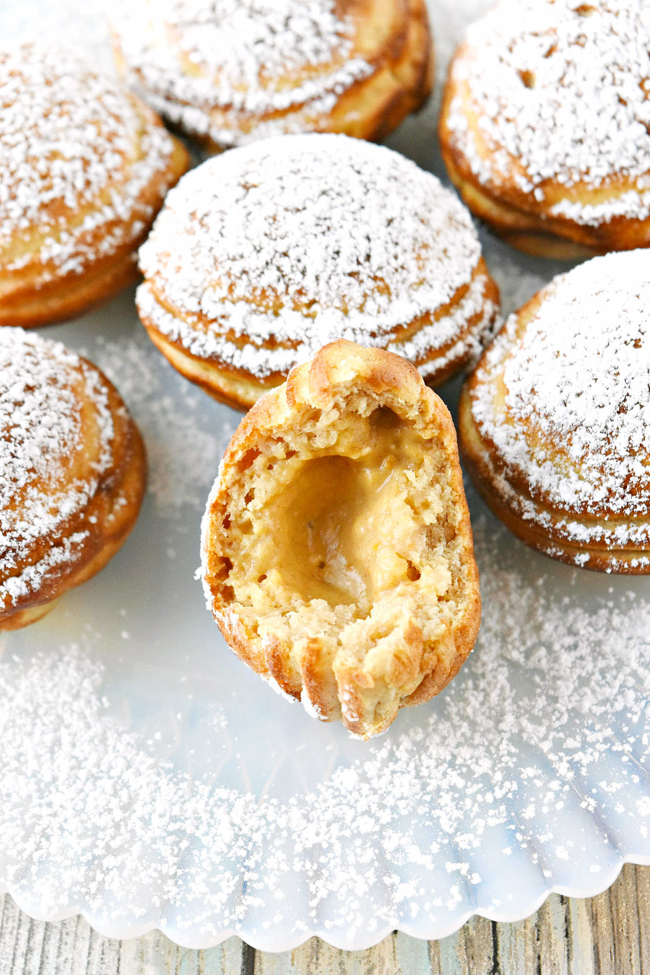 Say goodbye to boring breakfasts and hello to these Pumpkin Cheesecake Ebelskivers! Perfectly fluffy, filled with creamy pumpkin cheesecake, and finished with a dusting of powdered sugar. Your mornings just got a whole lot better.  #PumpkinCheesecakeEbelskiver #FallTreats #PumpkinSpice #CulinaryDelights #FoodieFaves #PumpkinCheesecake #Ebelskivers #FallTreats #FestiveFlavors #HolidayBaking