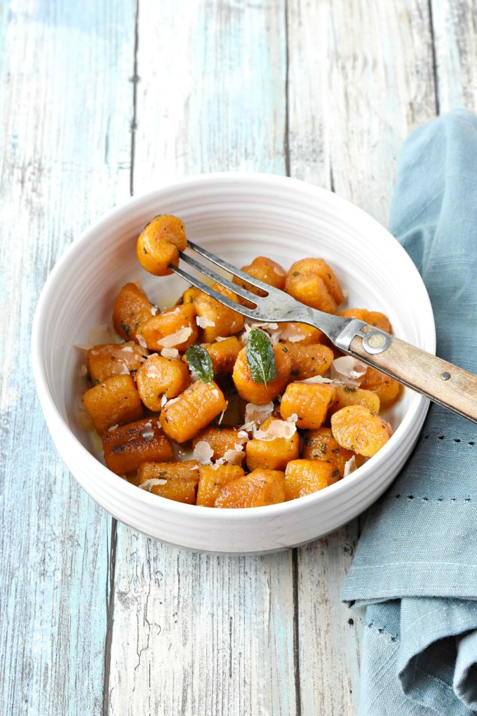 Pillows of pumpkin goodness make Pumpkin Gnocchi with Sage Butter Sauce a truly flavorful pasta dinner.  Add some sausage for a more hearty dinner for your family. #PumpkingWeek