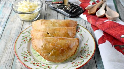 Dad always had sharp cheddar cheese with his apple pie.  I added Cabot Vermont sharp cheddar to the crust of these Apple Cheddar Hand Pies.  Not only do the smell amazing while baking, but taste scrumptious warm from the oven. #ChristmasSweetsWeek