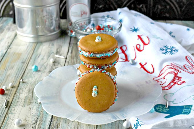 Perfectly delicious and packed with amazing gingerbread flavor, these Gingerbread Macaron have the best cream cheese buttercream filling.  The combination of flavors and cute Sprinkle Pop decorations make these irresistible! 