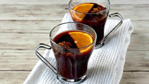 Warm up with the spicy goodness that is mulled wine!  Gløgg is a Swedish mulled wine packed with spice, a little sugar, and some fresh orange flavor. #ChristmasSweetsWeek