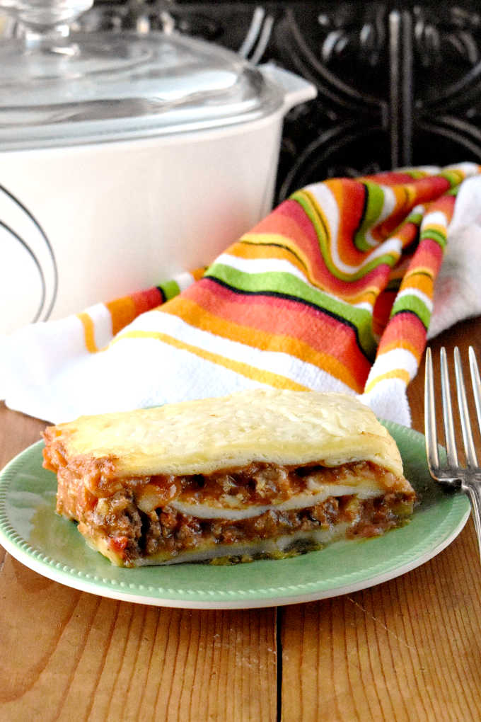 Delicious taco meat is combined with tomatoes and cheese soup before being sandwiched between layers of flour tortillas.  Taco Lasagna is the best of both worlds combining tacos and lasagna into one family friendly dish!