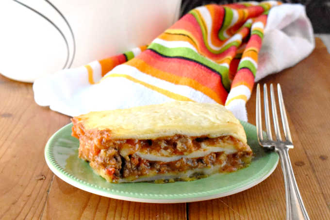 Delicious taco meat is combined with tomatoes and cheese soup before being sandwiched between layers of flour tortillas.  Taco Lasagna is the best of both worlds combining tacos and lasagna into one family friendly dish!