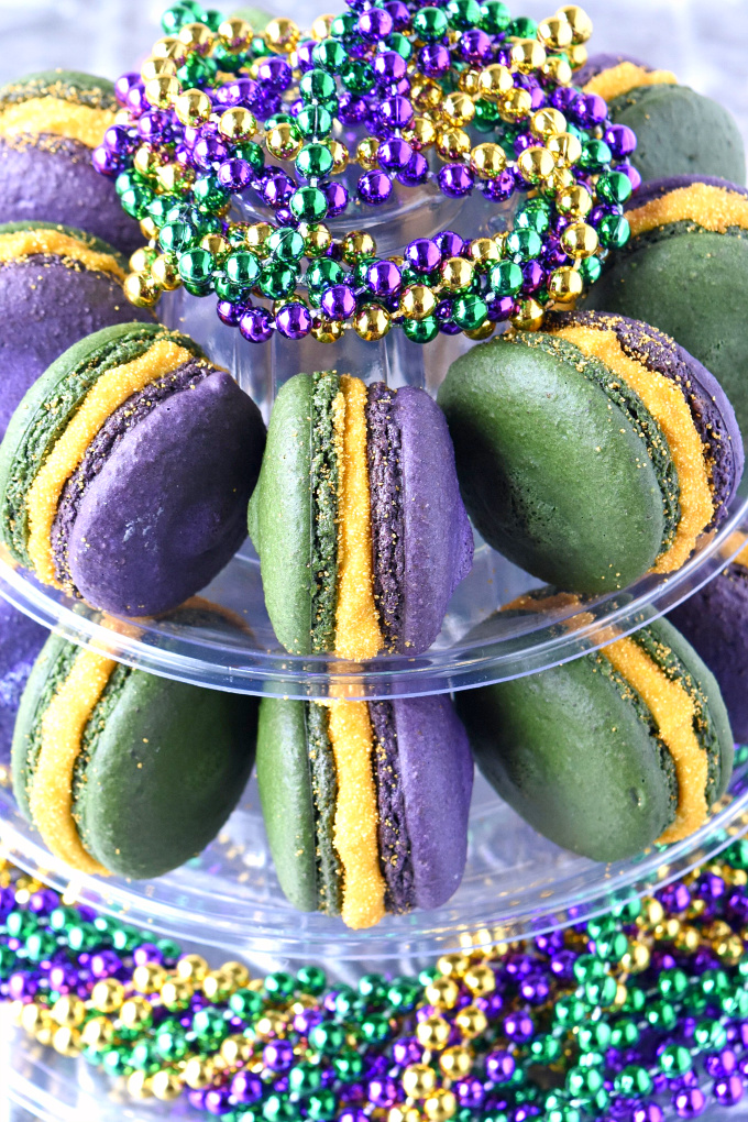 Bananas Foster Macaron are a party in your mouth!  With banana shells and salted caramel with rum in the buttercream, these macaron taste just like #MardiGras.