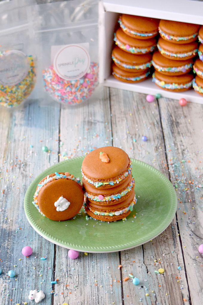 With carrot juice powder and spices in the shells, these Carrot Cake Macaron taste just like a carrot cake! The cream cheese buttercream filling helps bring the flavors home. The sprinkles are just because they're fun! #SpringSweetsWeek