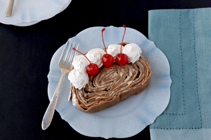 Take your traditional crepe cake and turn it on its side! Chocolate Crepe Cake Roll is a fun and different twist on both a cake roll and a crepe cake. #SpringSweetsWeek