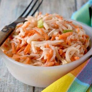Swap out the cabbage in your slaw and try fresh and delicious kohlrabi.  Carrot Kohlrabi Coleslaw is super crunchy, has great flavor, and is the perfect twist on a southern classic picnic dish. #OurFamilyTable
