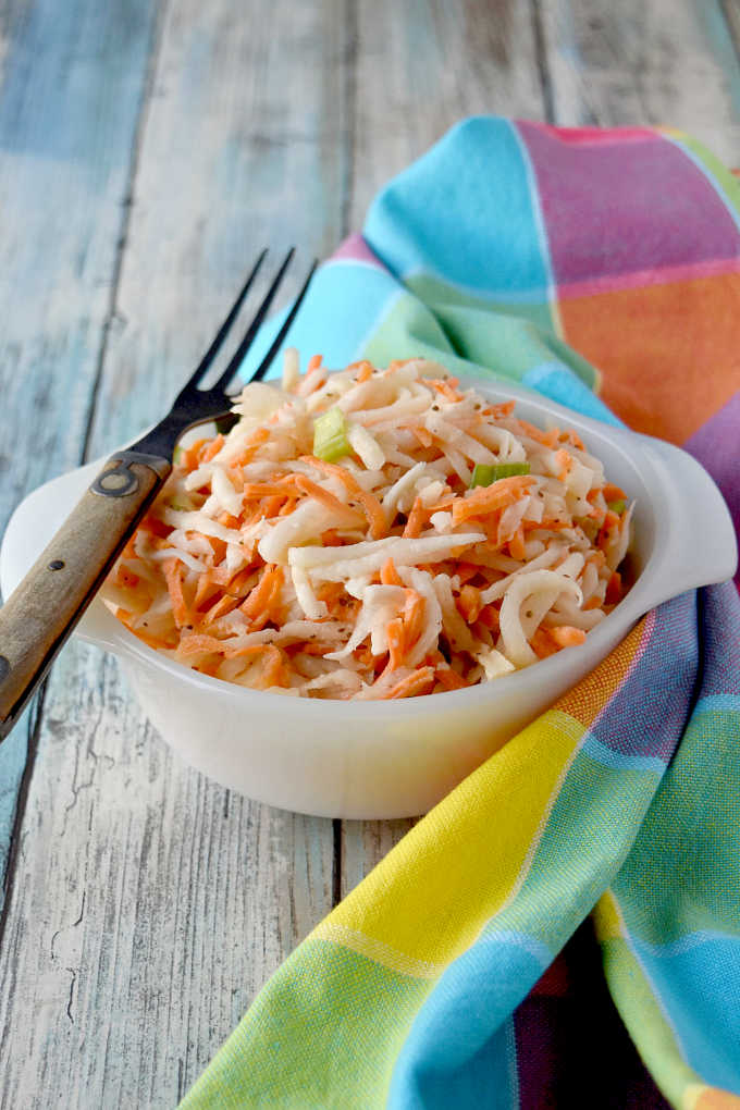 Swap out the cabbage in your slaw and try fresh and delicious kohlrabi.  Carrot Kohlrabi Coleslaw is super crunchy, has great flavor, and is the perfect twist on a southern classic picnic dish. #OurFamilyTable