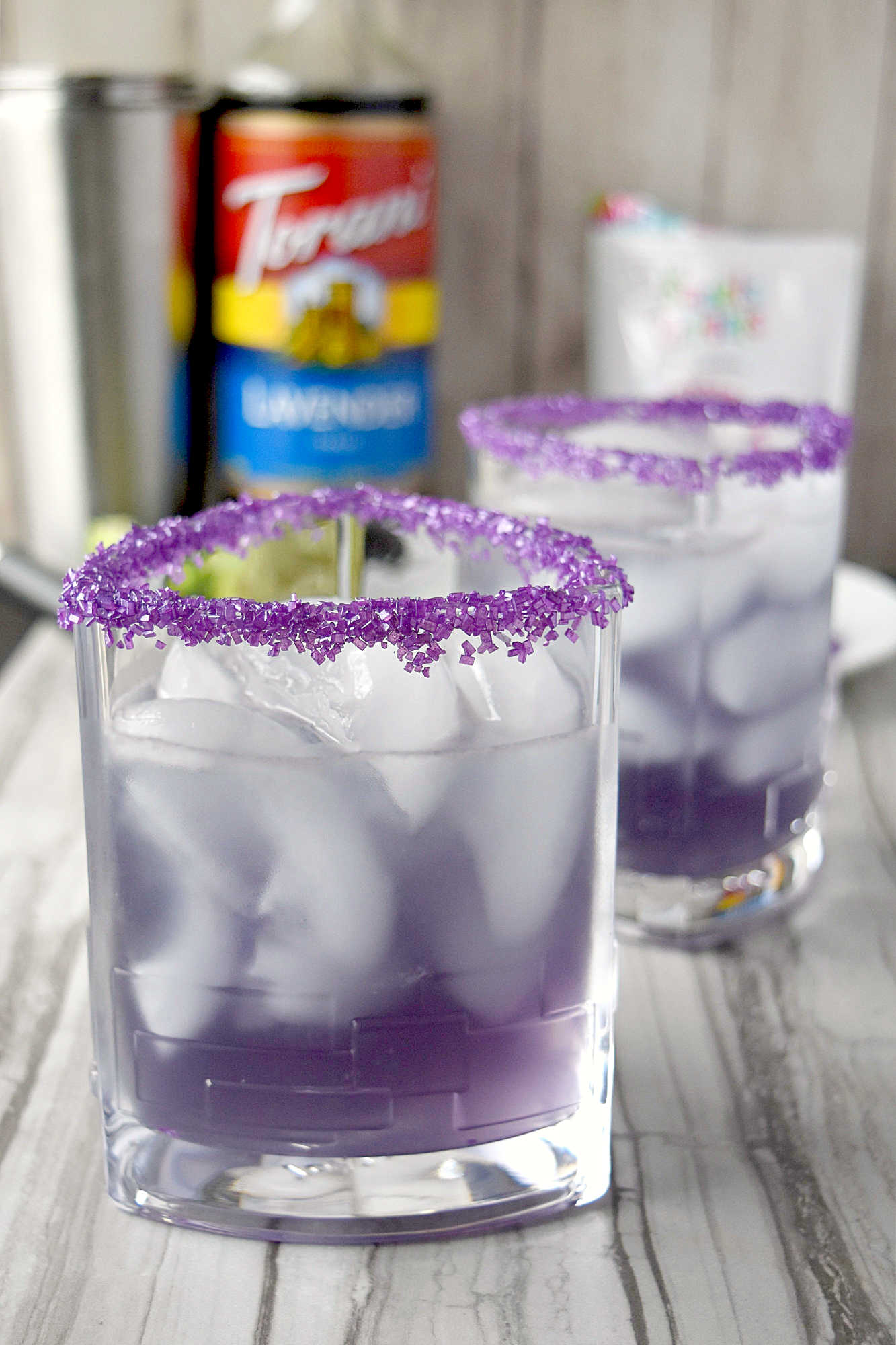 Have you ever tasted a Lightning Lavender Margarita? The balance of floral sweetness and zesty punch might become your new favorite. #BrunchWeek #JoyJolt #DrinkforJoy #Torani #SweetSquad #LightningLavenderMargarita #LavenderCocktails #CraftMargaritas #MixologyMagic #SummerSips