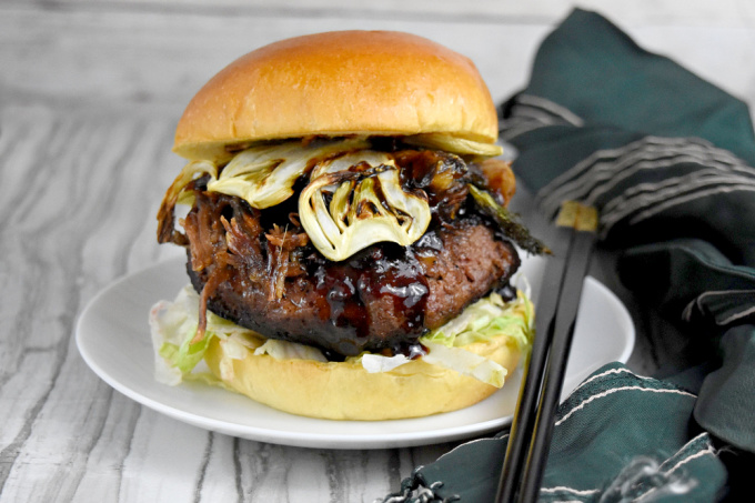 Asian Inspired Short Rib Burger has soy, ginger, sesame oil, and hoisin sauce. It's topped with braised short ribs marinated with lemongrass, garlic, ginger, and soy sauce and crispy fennel chips. It's packs mouthful after delicious mouthful of flavor. #BurgerMonth