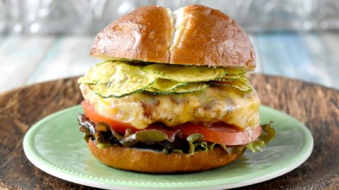 Apple Cheddar Chicken Burgers have apples, onions, ancho chile powder, and buttermilk soaked breadcrumbs. As if that wasn't enough, they're flecked with Cabot extremely sharp Cheddar cheese and topped with zucchini chips, too.