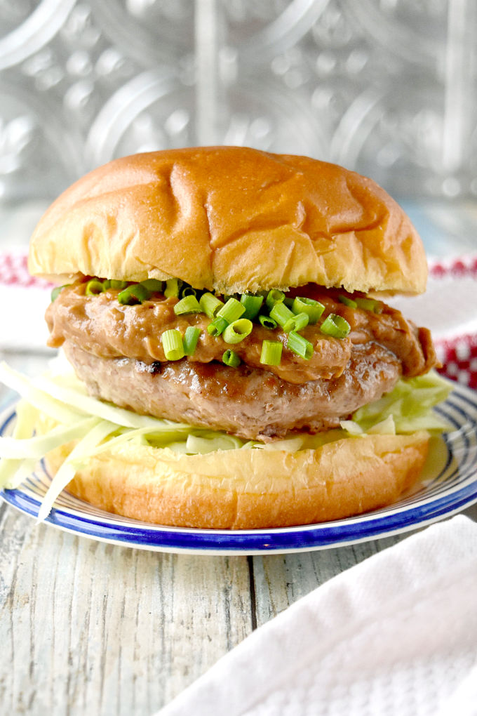 Satay Burger with Tamarind Fig Peanut Sauce has a juicy pork patty topped with a complex tamarind fig satay sauce that's irresistible!  The sweet tamarind and fig is paired with the salty soy and oyster sauces with a kick of ginger. #BurgerMonth #BurgerMonth2019