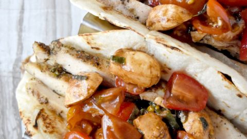 Market fresh tomatoes and basil make up the topping for Bruschetta Chicken Tacos. The Tuscan seasoned thighs and marinated Mozzarella add layers of delicious flavor you'll love! #FarmerksMarketWeek