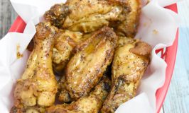 Crispy Lemon Pepper Wings have that slightly tart and peppery taste you’d expect from lemon pepper.  Made in the air fryer, they're super easy, crispy and low maintenance for your game day. #OurFamilyTable