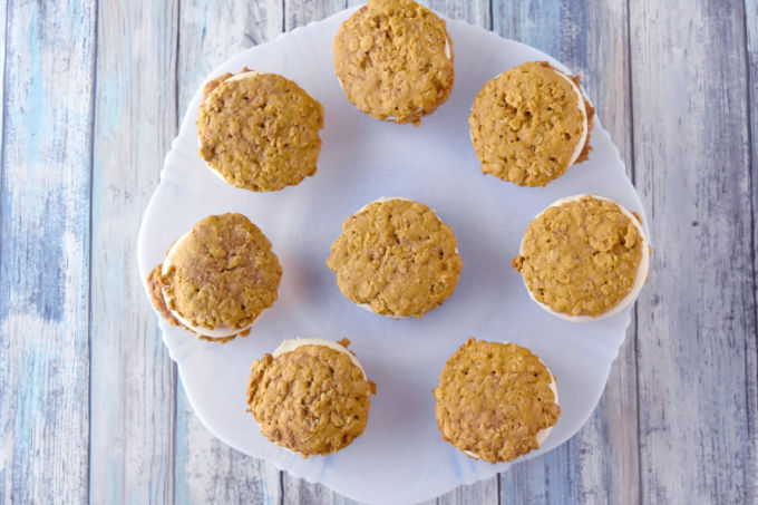 Pumpkin Oatmeal Cream Pies have that oatmeal cream pie flavor with a hint of pumpkin and spices throughout. They’re soft, chewy, and totally irresistible. #PumpkinWeek