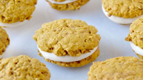 Pumpkin Oatmeal Cream Pies have that oatmeal cream pie flavor with a hint of pumpkin and spices throughout. They’re soft, chewy, and totally irresistible. #PumpkinWeek