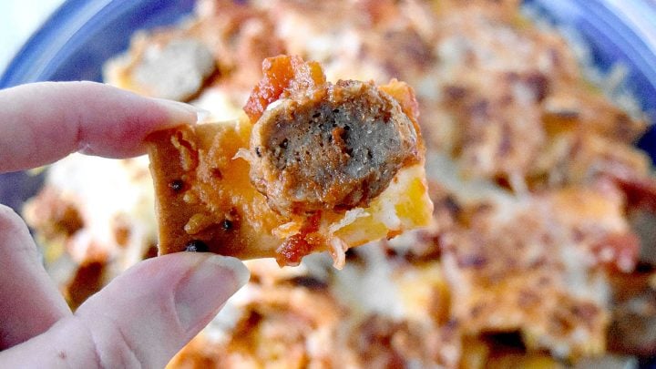Italian Meatball Nachos are a delicious twist on your typical nachos.  These nachos are made super easy with frozen meatballs, jarred pizza sauce, and shredded mozzarella cheese. #OurFamilyTable
