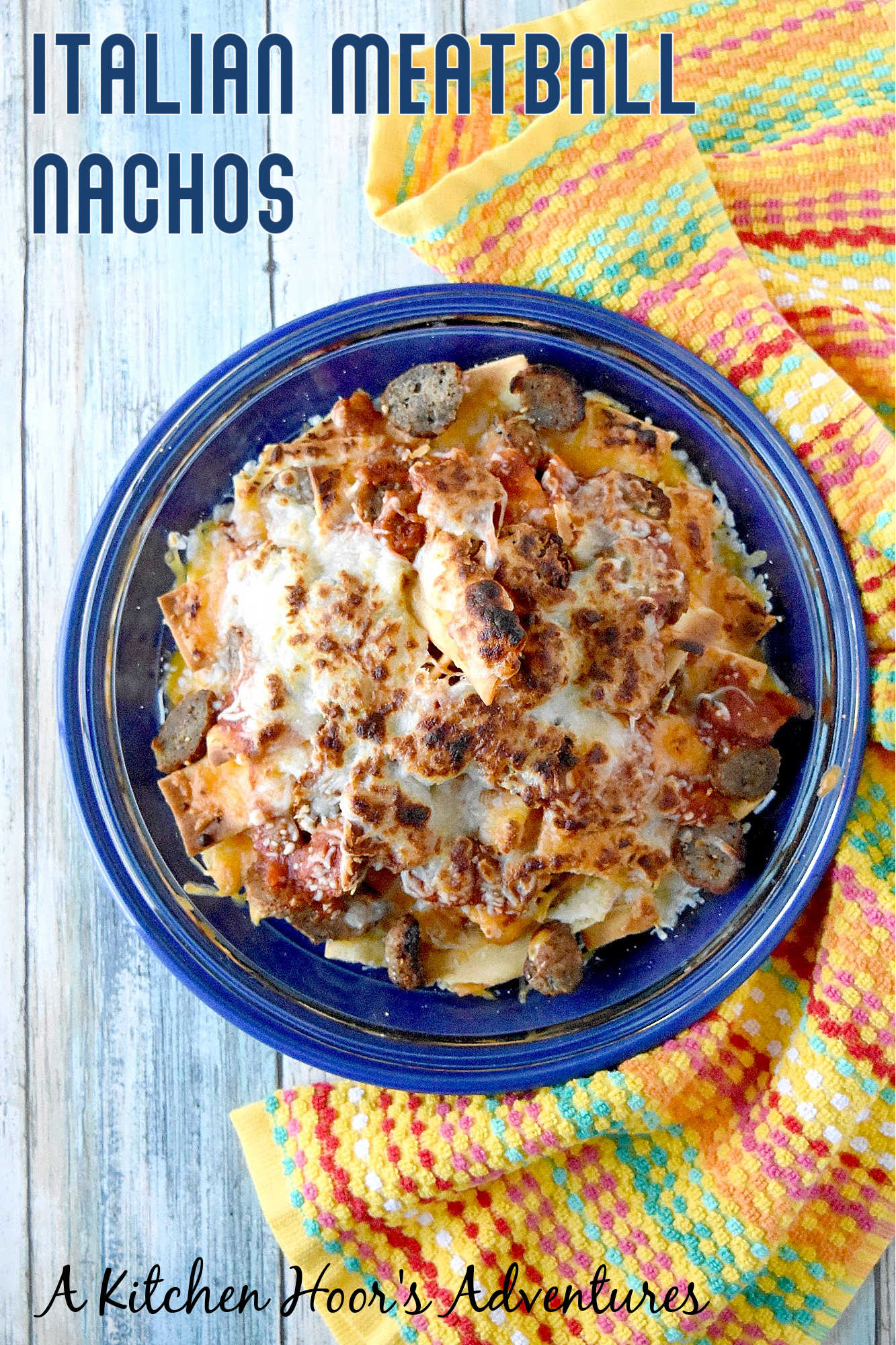 Italian Meatball Nachos are a delicious twist on your typical nachos.ย These nachos are made super easy with frozen meatballs, jarred pizza sauce, and shredded mozzarella cheese. #OurFamilyTable
