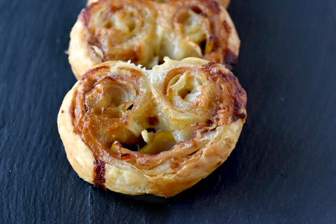 Sweet USA Pears and salty proscuitto combine with creamy blue brie in this easy but elegant appetizer.  Pear Proscuitto Palmiers come together in minutes, bake in under 20, and look gorgeous on the plate.