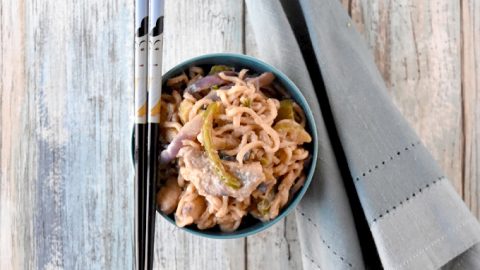 Instant ramen turns into a deliciously easy weeknight meal. Thai Peanut Chicken Ramen is packed with vegetables, peanut butter, and delicious Asian flavors. #OurFamilyTable