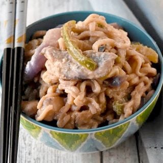 Instant ramen turns into a deliciously easy weeknight meal. Thai Peanut Chicken Ramen is packed with vegetables, peanut butter, and delicious Asian flavors. #OurFamilyTable