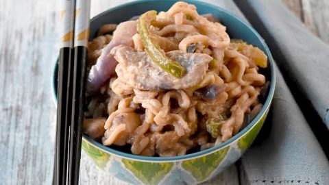 Instant ramen turns into a deliciously easy weeknight meal. Thai Peanut Chicken Ramen is packed with vegetables, peanut butter, and delicious Asian flavors. #OurFamilyTable