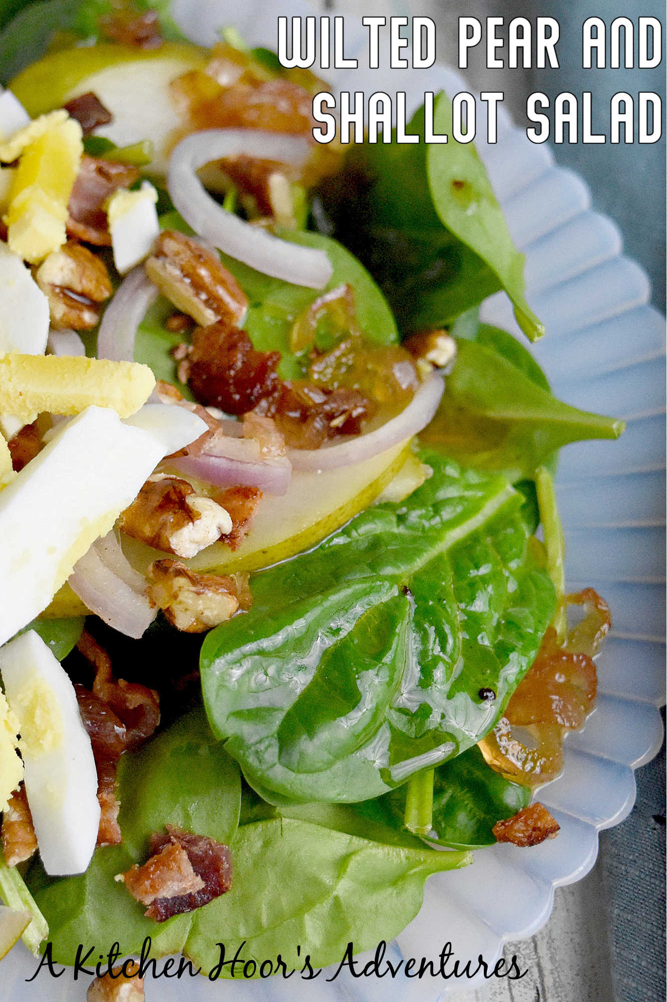 Sweet and tangy bacon dressing is drizzled over sweet pears, spinach, and sliced shallots. Top Wilted Pear and Shallot Salad with chopped pecans and sliced hard-boiled eggs for a hearty and delicious salad. #wiltedsalad #spinachsalad #pearsalad #bacondressing #WiltedSaladSensation #PearShallotEats #FarmtoTableFaves #HealthyGreensInspo #BlissfulBitesByUs