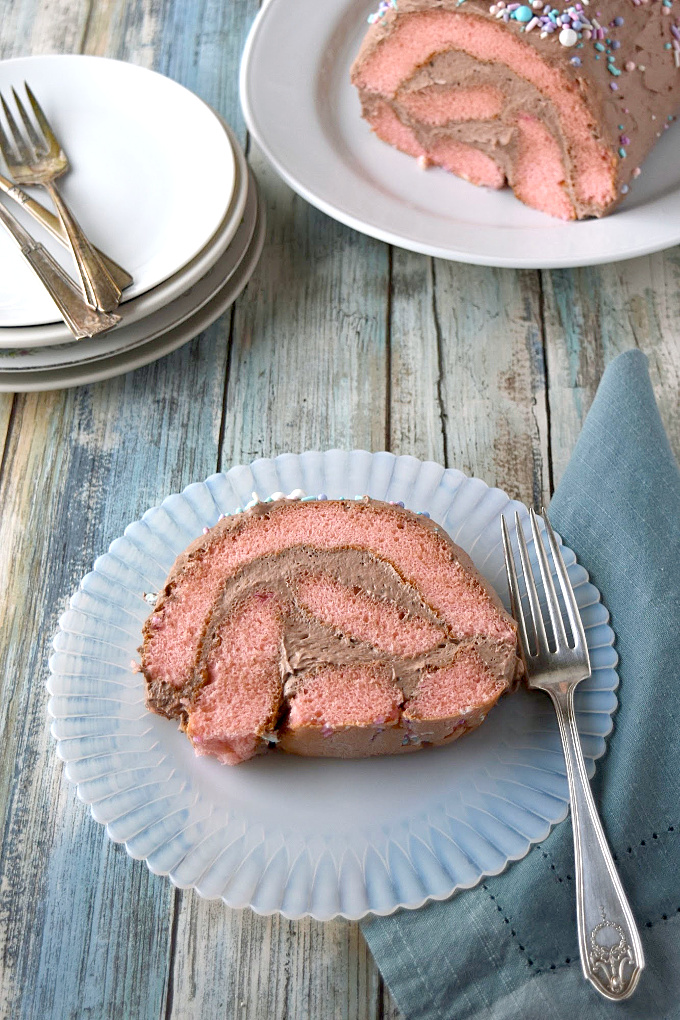 Easy chocolate mousse covers boxed strawberry cake in this Chocolate Covered Strawberry Cake Roll.  This is a simple and easy pantry recipe you can make with your kids.