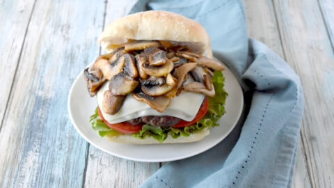 Inspired by the Shake Shack mushroom burger, this Mozzarella Stuffed Mushroom Burger is moist, delicious, and stuffed with the perfect amount of cheese. #BurgerMonth
