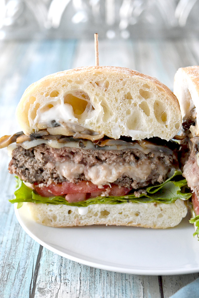 Inspired by the Shake Shack mushroom burger, this Mozzarella Stuffed Mushroom Burger is moist, delicious, and stuffed with the perfect amount of cheese. #BurgerMonth
