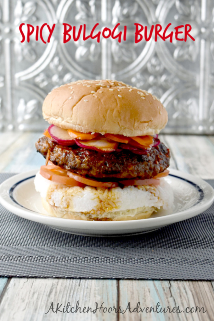 Spicy Bulgogi Burger is packed with garlic and ginger flavor, spicy Asian sauce, and topped with thinly sliced carrots and radishes.  It's a flavor and texture packed yum on a bun! #BurgerMonth