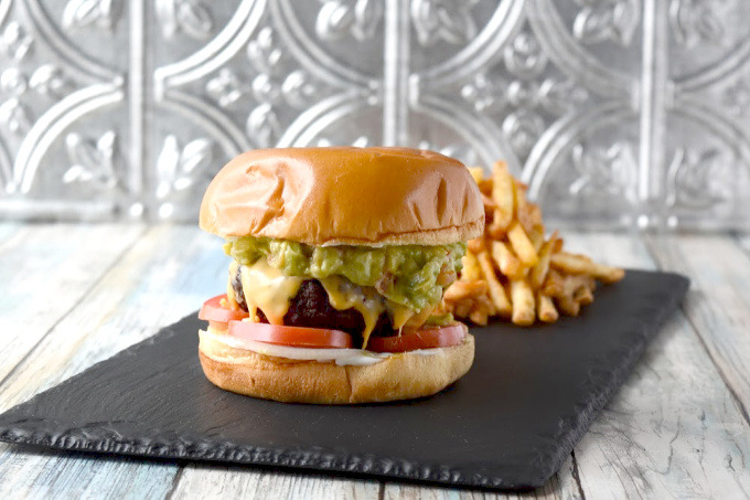 Carne Asada Burger with Chipotl Guacamole is a flavor packed burger you're family will love. The burger has jalapeno and tons of Latin spices in there for one kicked up burger!