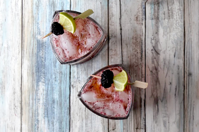 Blackberries and limes are muddle together then topped with craft bourbon and ginger beer in this Blackberry Bourbon Mule.  The tart lime and tasty berries compliment the smoky rich flavor of the bourbon. #BerryWeek