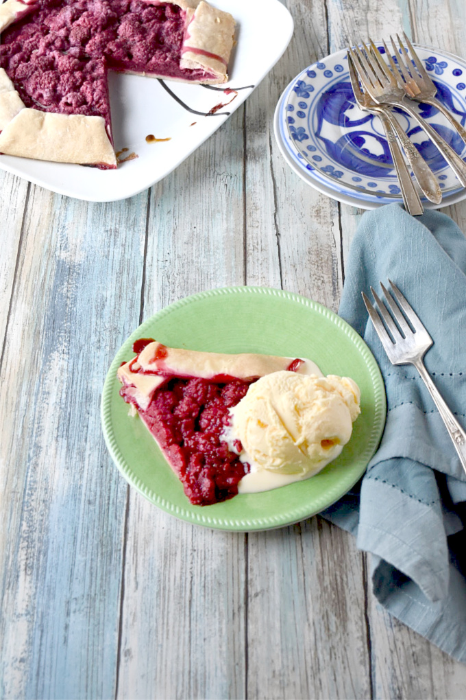 With a handful of ingredients, you can have this Raspberry Crostata on your barbecue table.  Topped with vanilla ice cream, it's perfect for summer! #BerryWeek