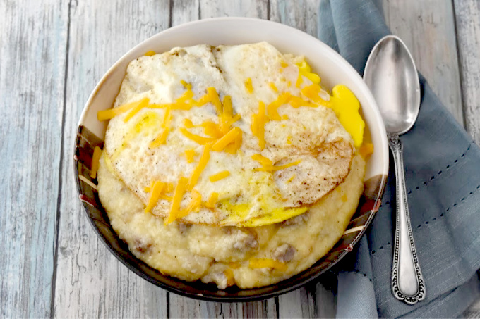Sausage Egg and Cheese Grits turns this southern breakfast staple into a whole meal on it's own.  This could easily turn into a grits bar with cheese and meat choices for your guests.
