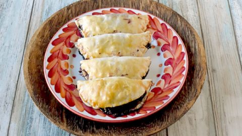 With only six ingredients, Blueberry Hand Pies are simple and simply delicious!  With a hint of ginger, these hand pies are packed with flavor. #SummerDessertWeek