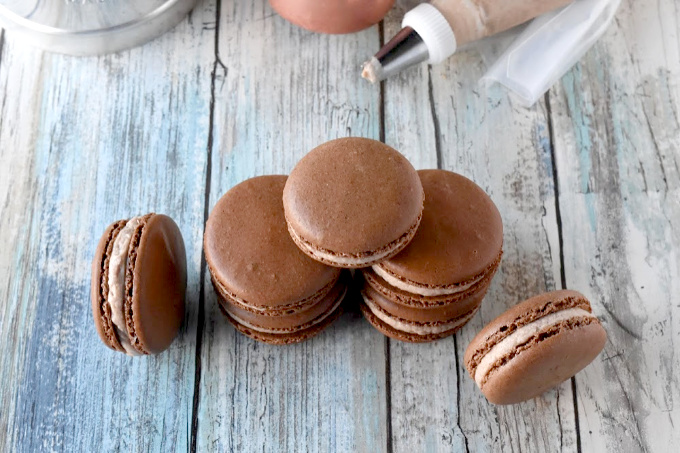 Brownie Batter Macaron have cocoa powder in the shells and brownie batter in the buttercream filling.  They're rich, chocolate, and oh so delicious. #SummerDessertWeek