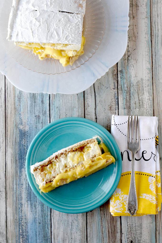 Tropical Icebox Cake has mango and pineapple buried in the custard and mousse style filling between the graham cracker layers.  It's simple and simply delicious. #SummerDessertWeek