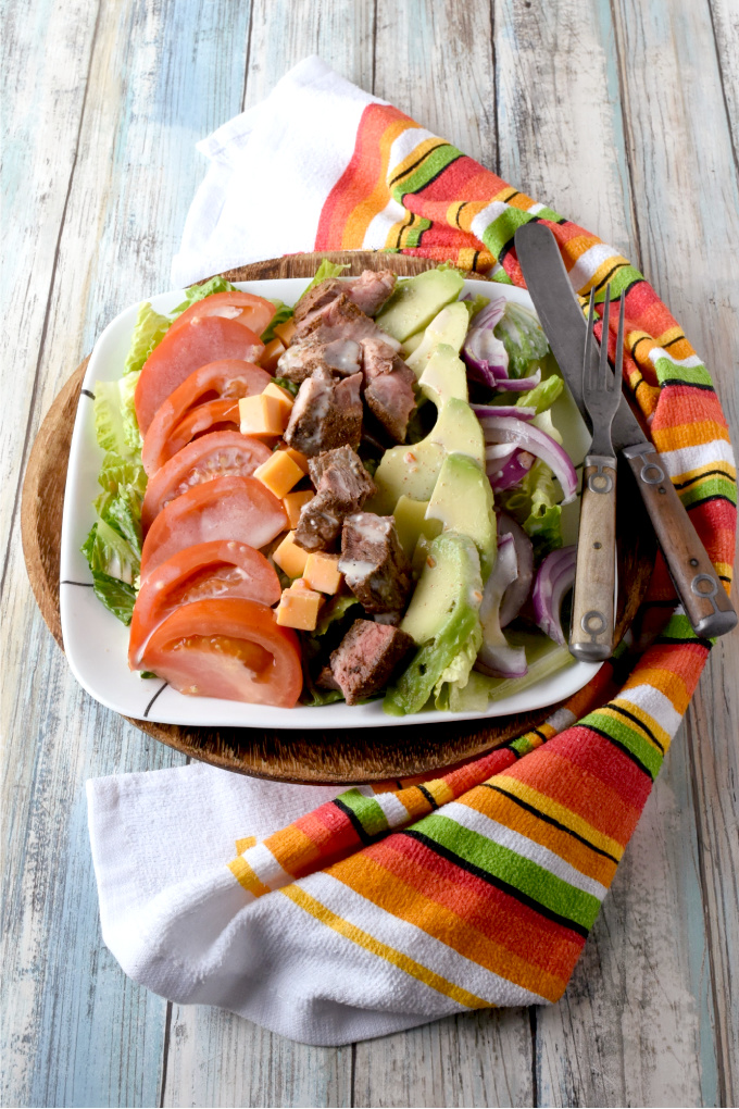 Blackened Steak Cobb Salad has a bit of spice and heat on top of crisp greens with onions, tomatoes, avocadoes, cheese, and hard-boiled eggs.  It’s a hearty dinner salad that is quick and easy to make. #FarmersMarketWeek