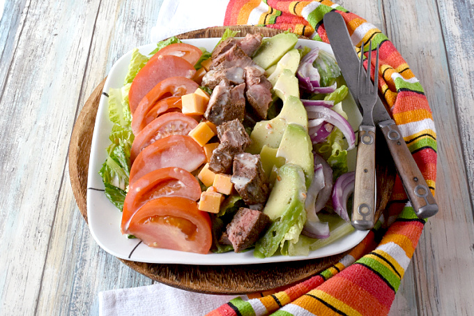 Blackened Steak Cobb Salad has a bit of spice and heat on top of crisp greens with onions, tomatoes, avocadoes, cheese, and hard-boiled eggs.  It’s a hearty dinner salad that is quick and easy to make. #FarmersMarketWeek