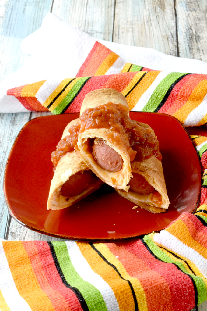 Air Fryer Hot Dog Taquitos are simple, quick, and super fun to eat.  Topped with cheese and salsa, these are a kicked up cheesy snack your kids will love. #BacktoSchoolTreats