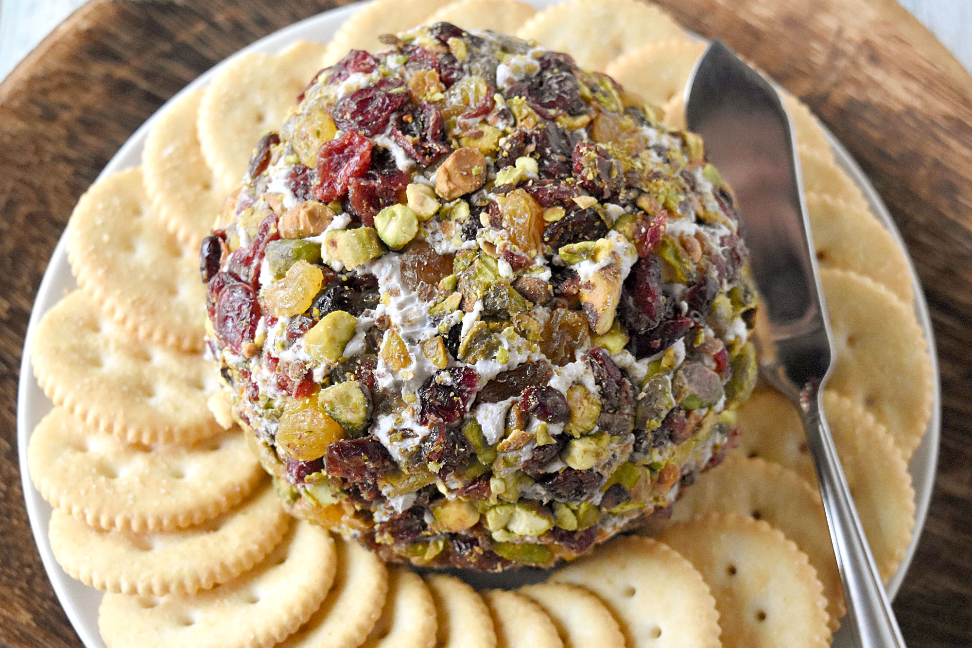 Blue Cheese Cranberry Ball is packed with creamy blue cheese, roasted cranberries, herbs, and spices.  It takes just a few minutes to whip up for any planned or unplanned dinner guests. #CranberryWeek