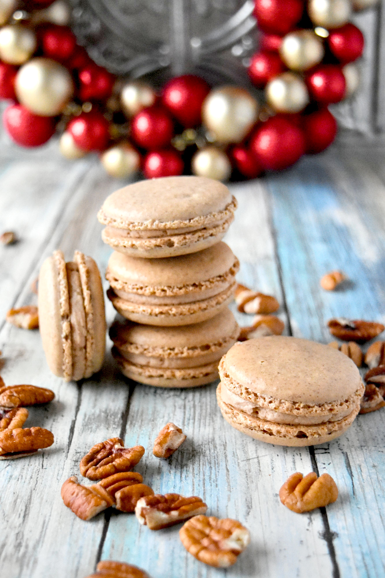 Cinnamon Pecan Macaron have the flavor of those fair cinnamon pecans in a macaron cookie.  They’re packed with pecan and cinnamon flavors with a hint of caramel in the filling. #ChristmasCookies