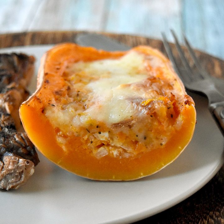 Twice Baked Butternut Squash is a twist on the twice baked potato. The sweet squash is combined with prosciutto, goat cheese, and shallots then topped with Gruyere cheese for a truly scrumptious side dish. #HolidaySideDishes